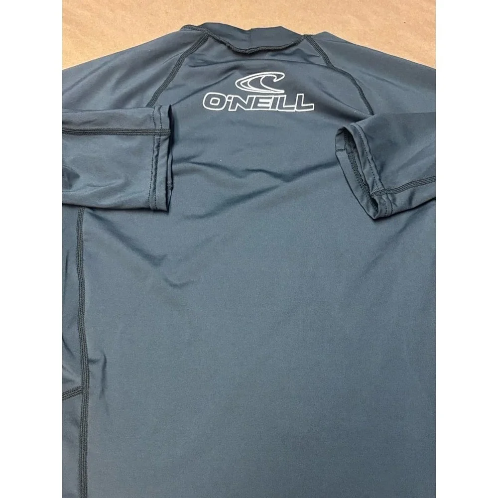 Boys size Medium gray O'Neill rash gaurd with white logo EU.  50+ ultraviolet pr